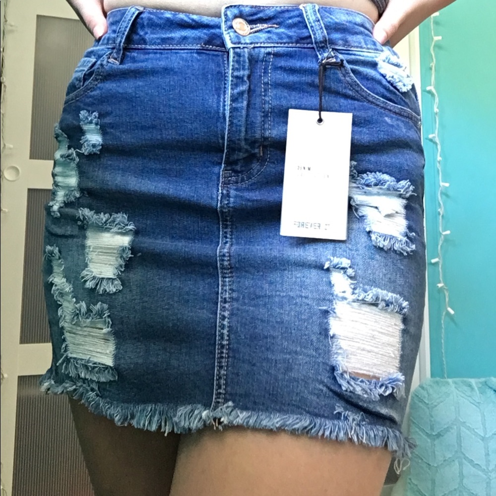 medium wash distressed denim skirt